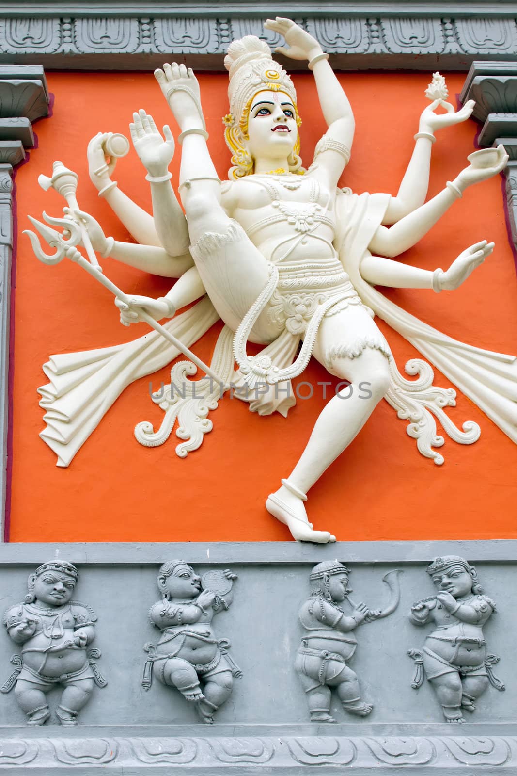 Hindu Goddess with Many Arms  Holding Weapons Statue on Wall of Sri Senpaga Vinayagar Temple