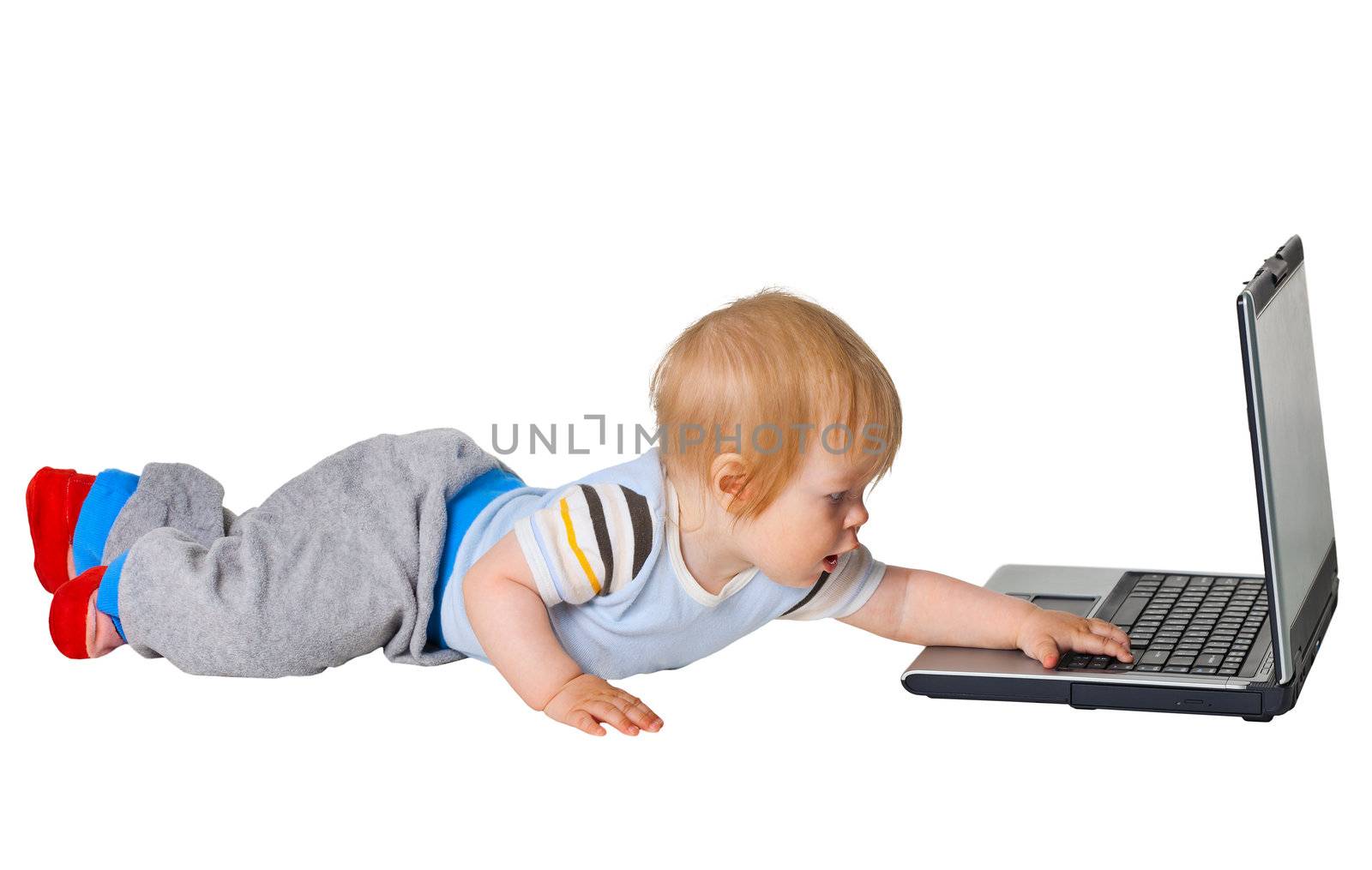 A little boy runs to the computer isolated on white background