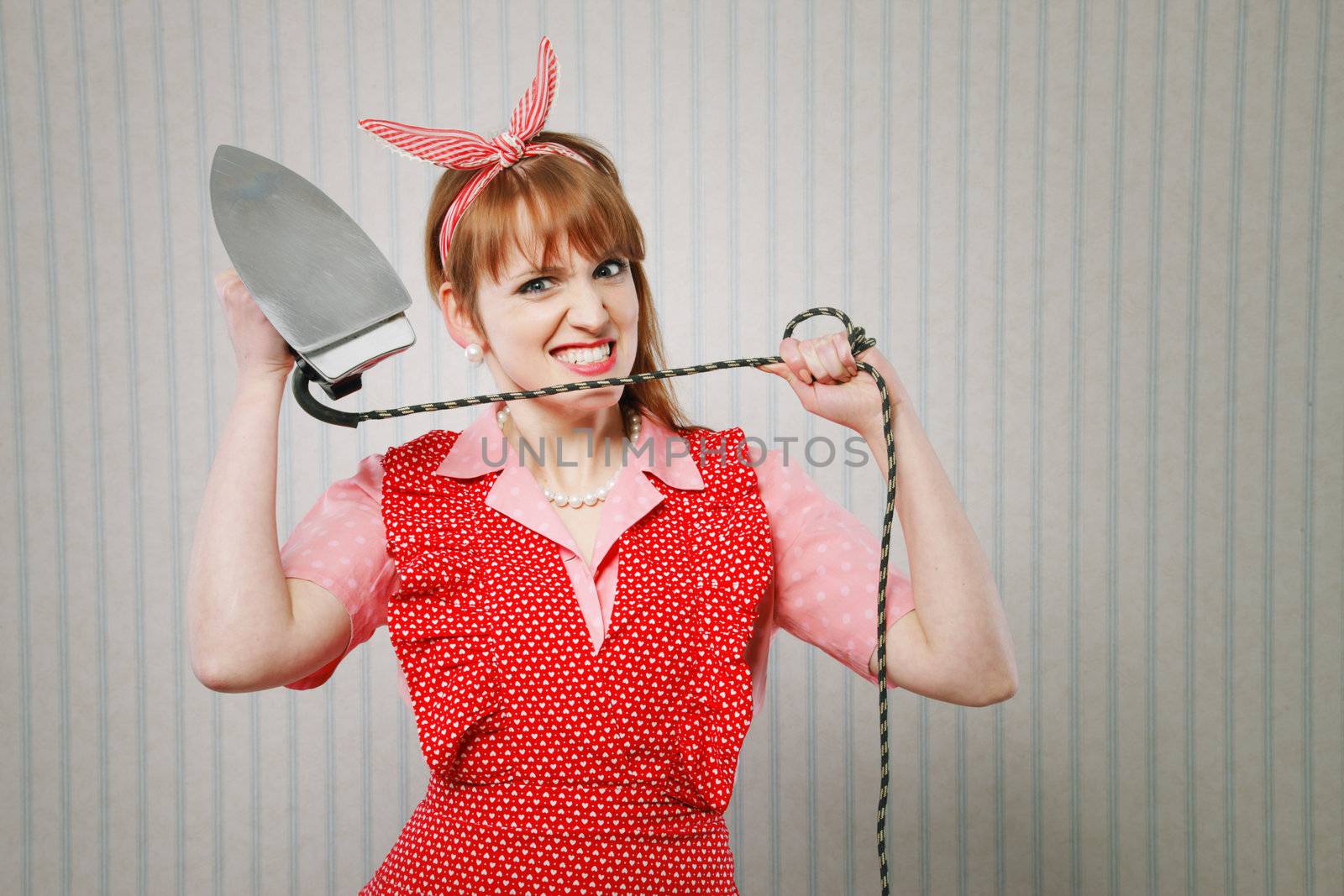 Stressed young woman  housewife with iron 