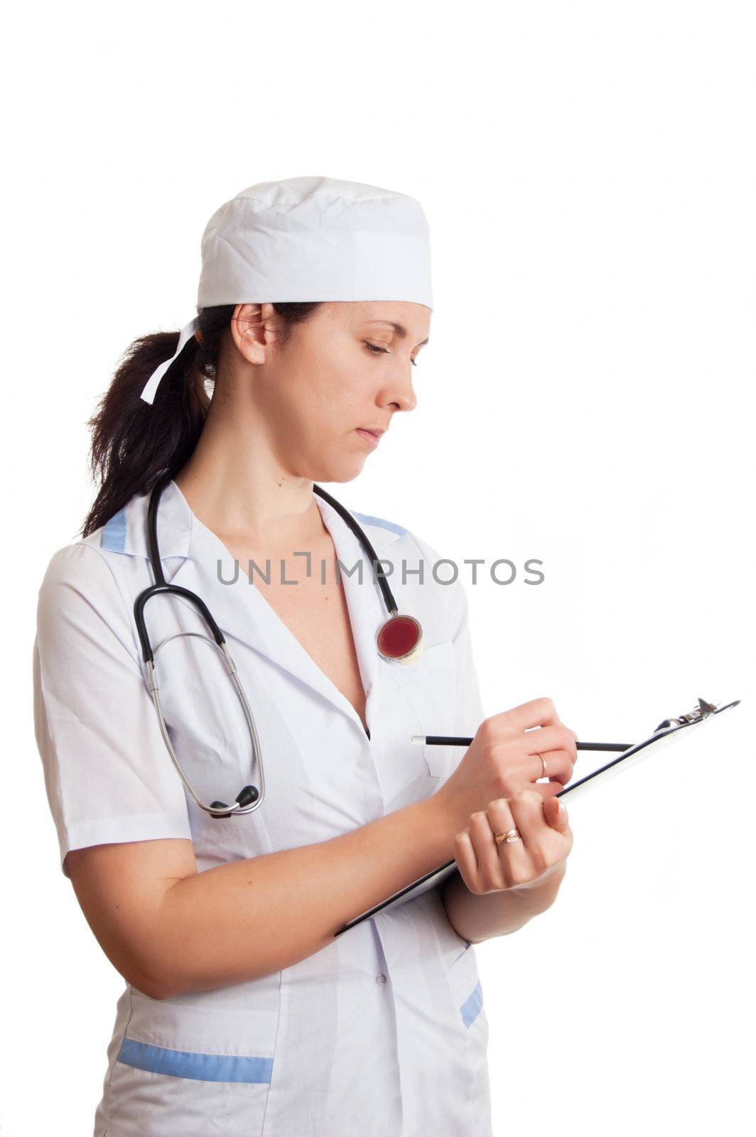 Medical doctor woman with stethoscope writing in papers over white