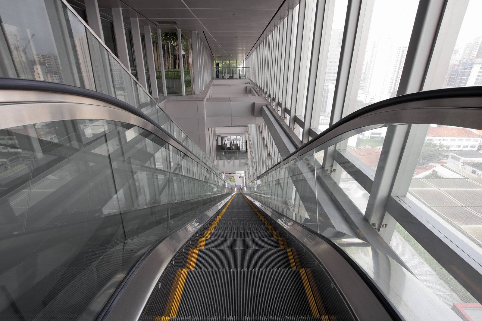 Long Generic Escalators in Public Library Going Up or Down