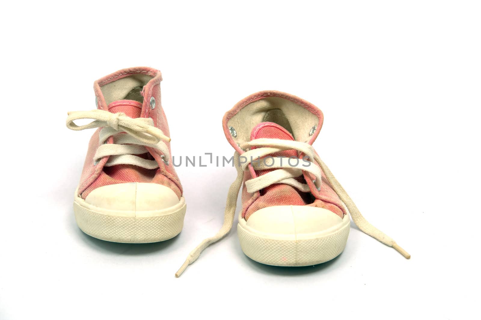 Baby first sports shoes on white background