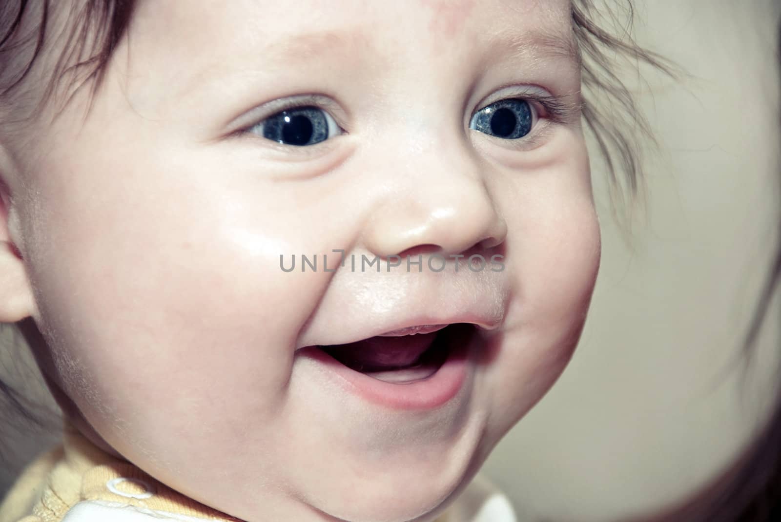 Close-up portrait of a happy little boy. Soft focus
