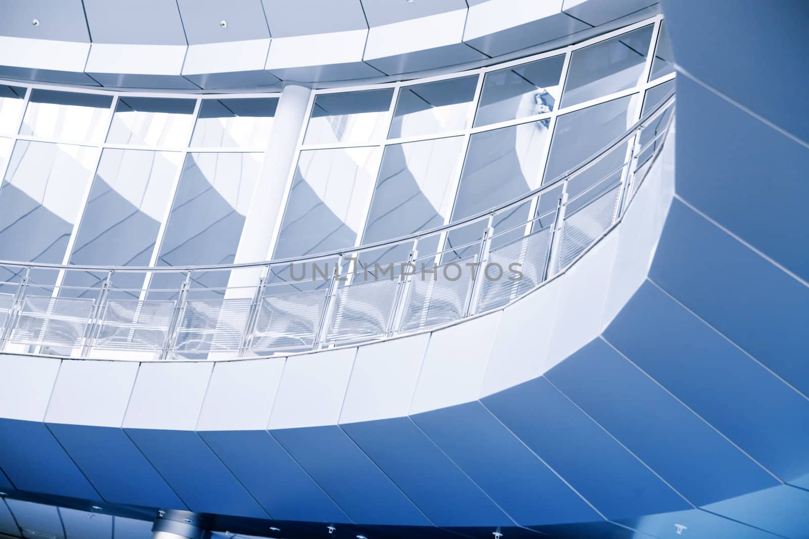 rounded balconies from glass and metal in a modern interior