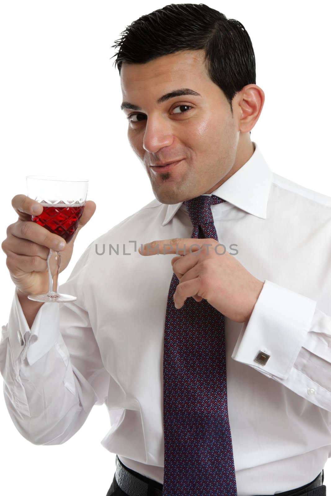 A man holding a glass of red wine and recommending it after tasting.  White background.