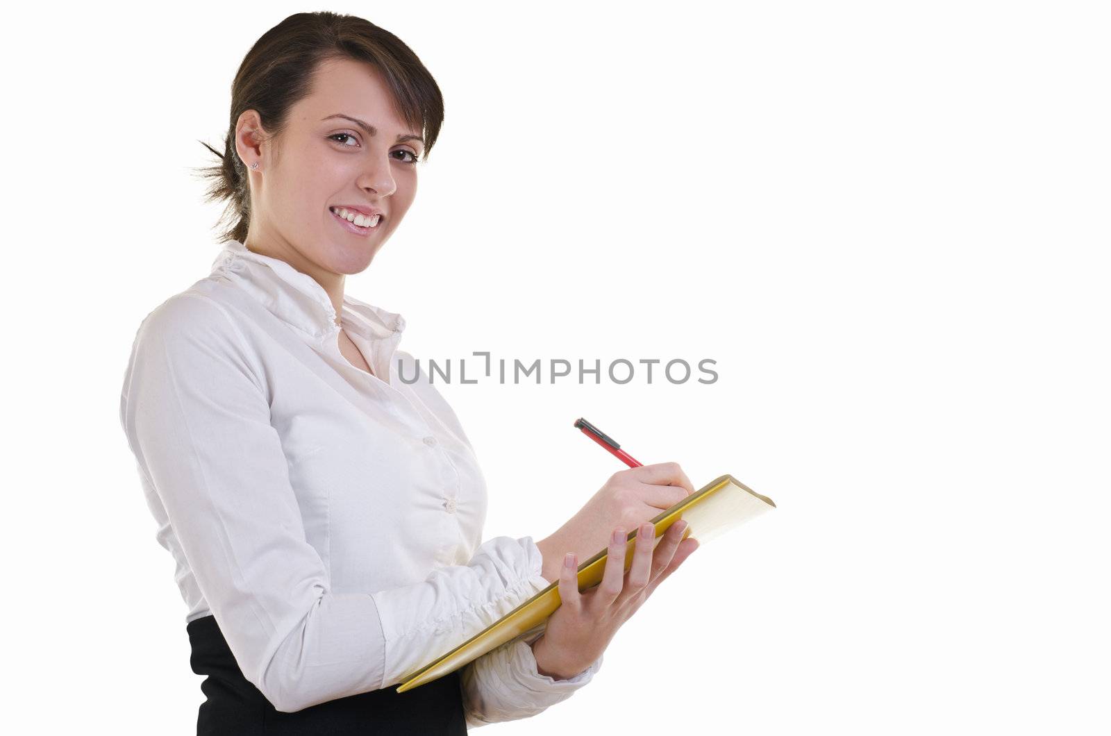 A businesswoman writes down answers on a questionnaire or fills out forms during an interview, high key 