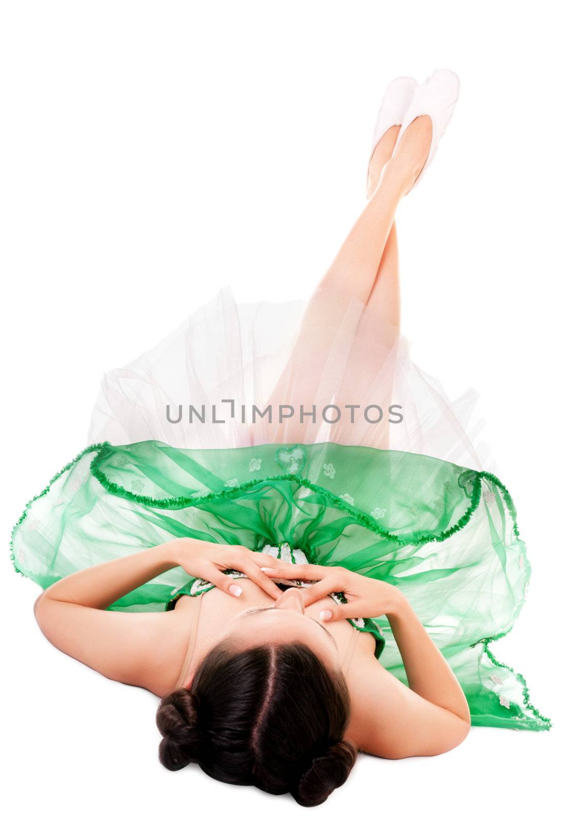 Lying ballerina in green dress isolated on white background