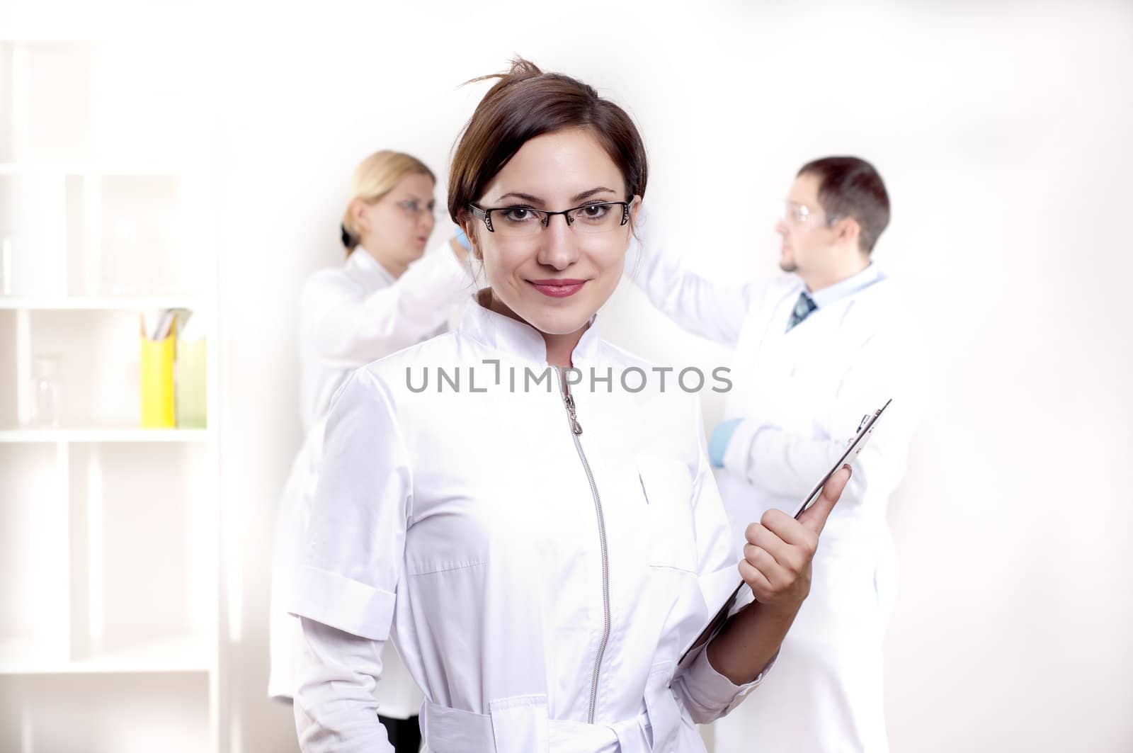 portrait of doctor, holds a tablet in the office