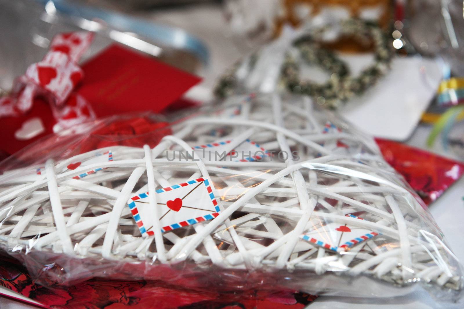 Unique gift in the shape of a heart bound with interwoven thongs to give the shape for a loved one on a wedding, Valentine or anniversary