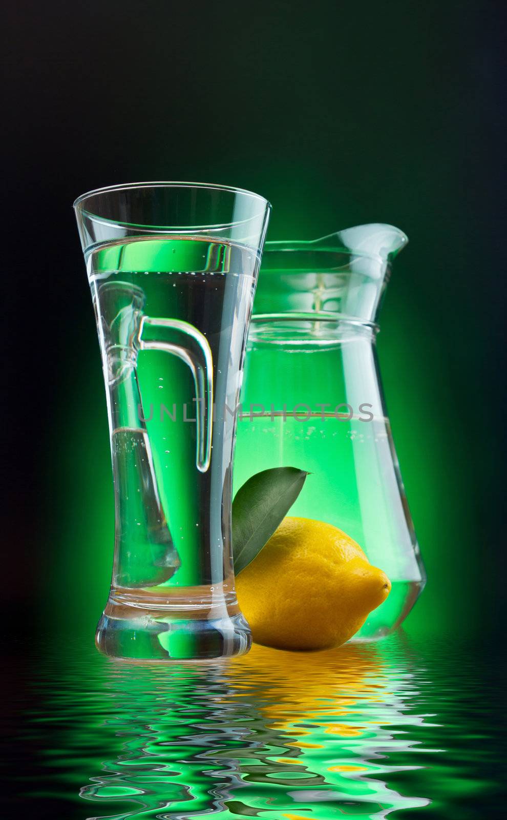 mineral water and lemon on a colored background