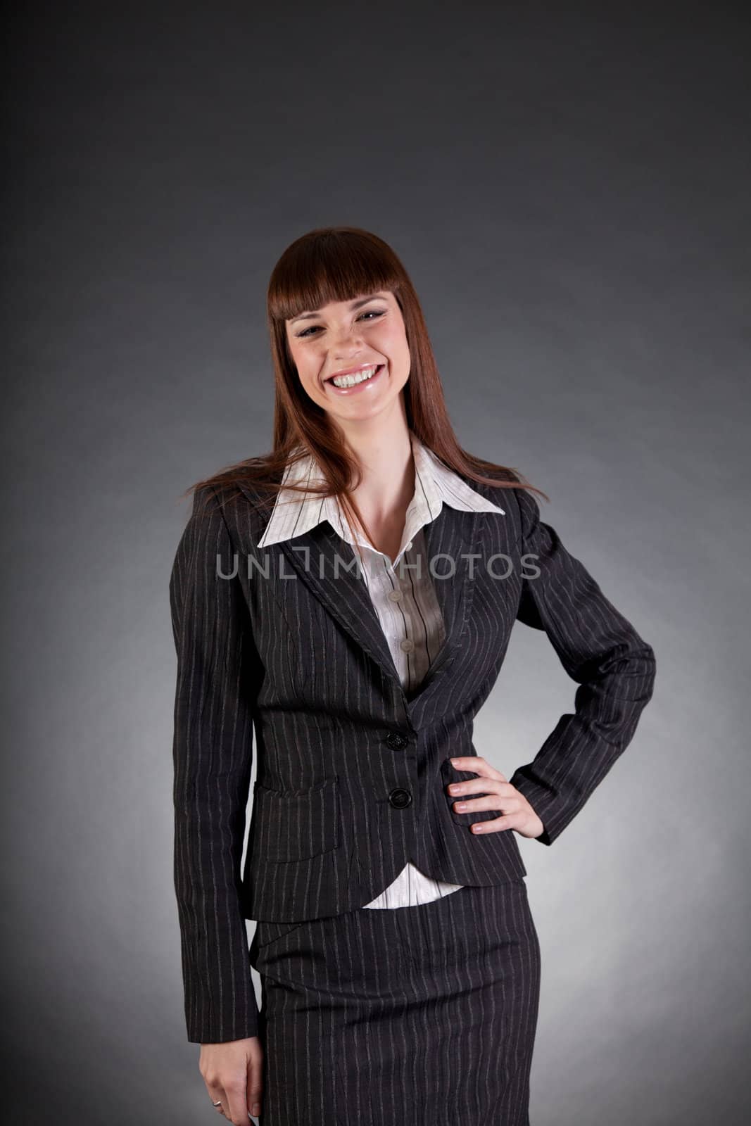 Laughing looking business woman, studio shot 