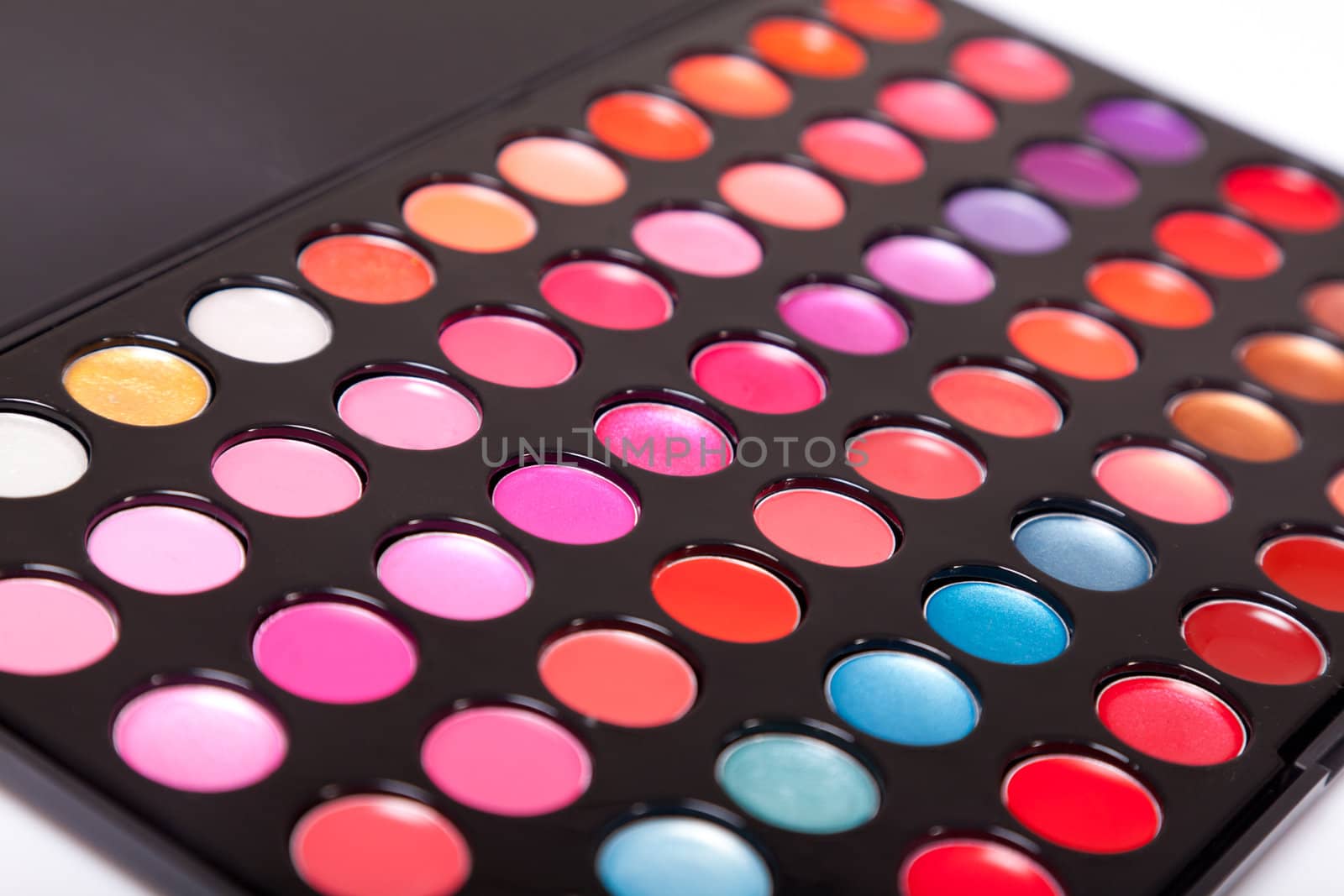 Close-up shot of lip gloss palette, soft focus 