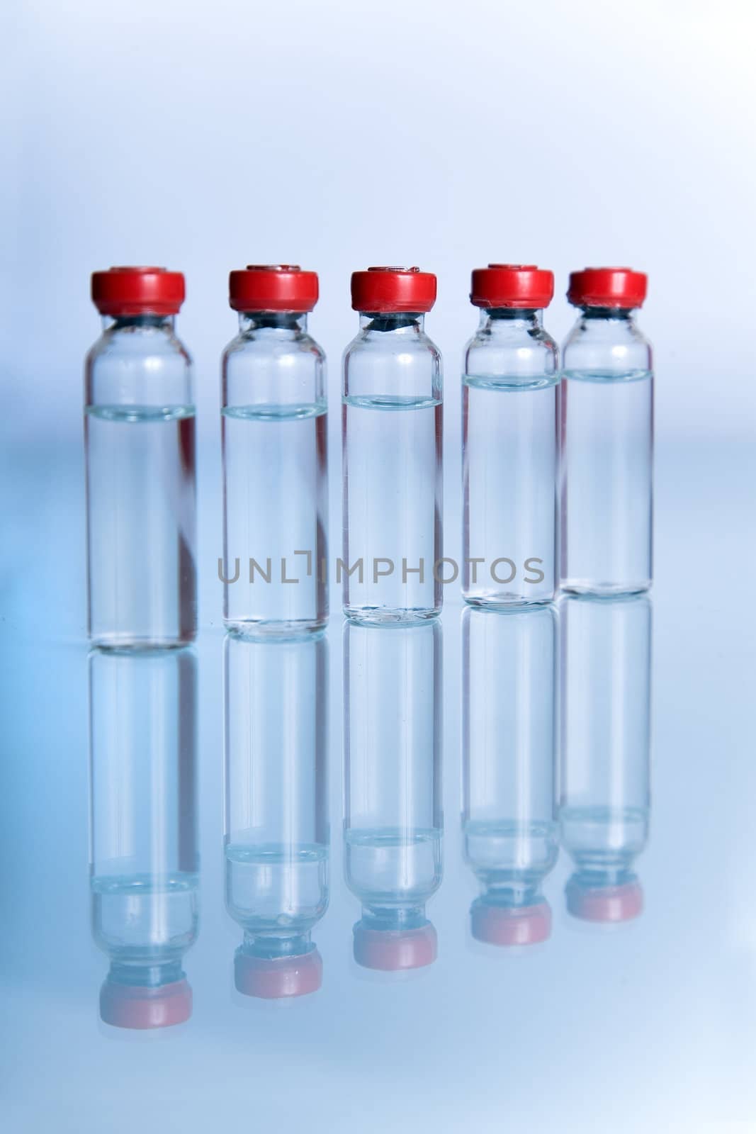 Vials with liquid for medicine or science  by Elisanth