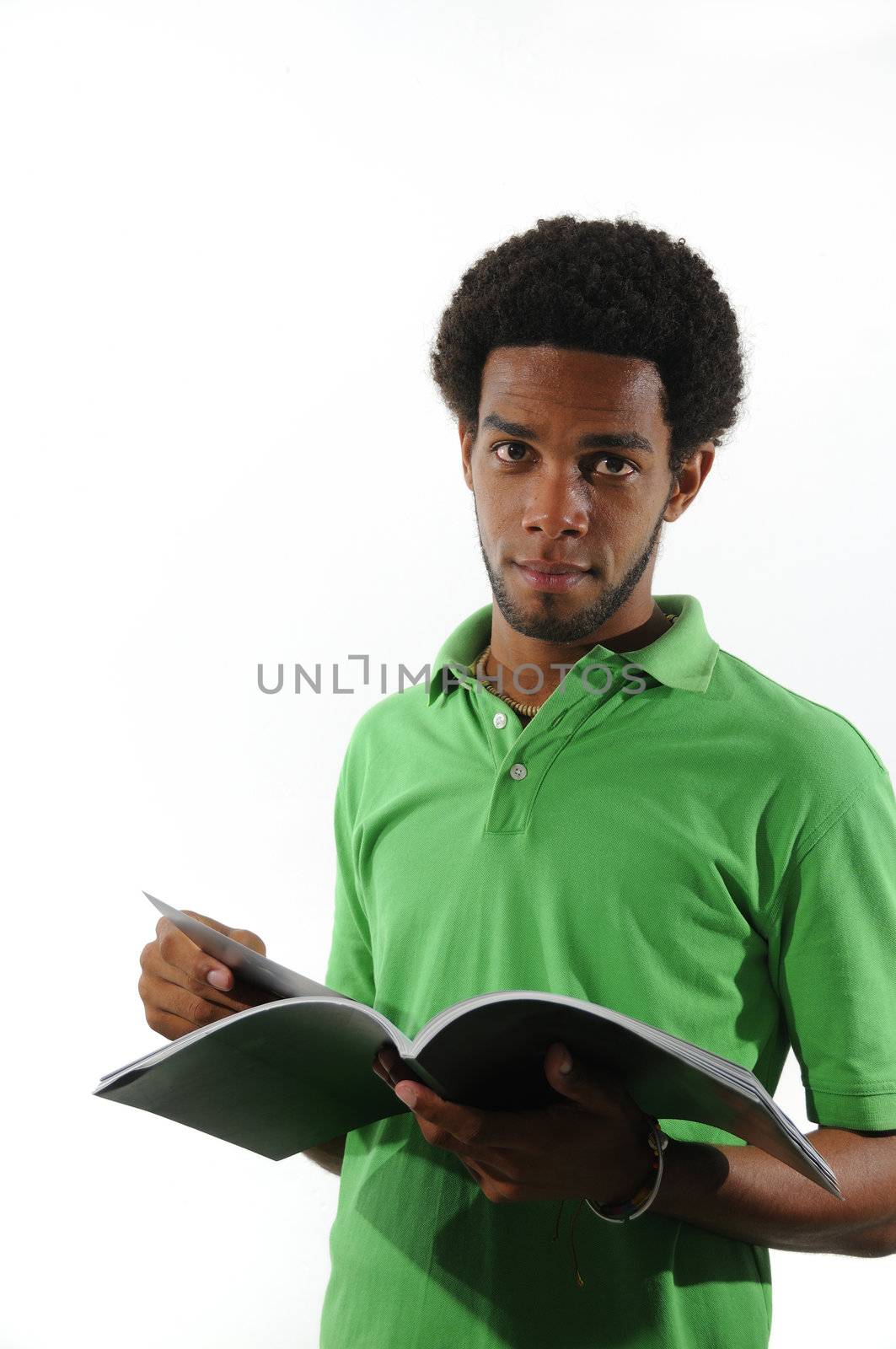 Young african man reading a magazine by rgbspace