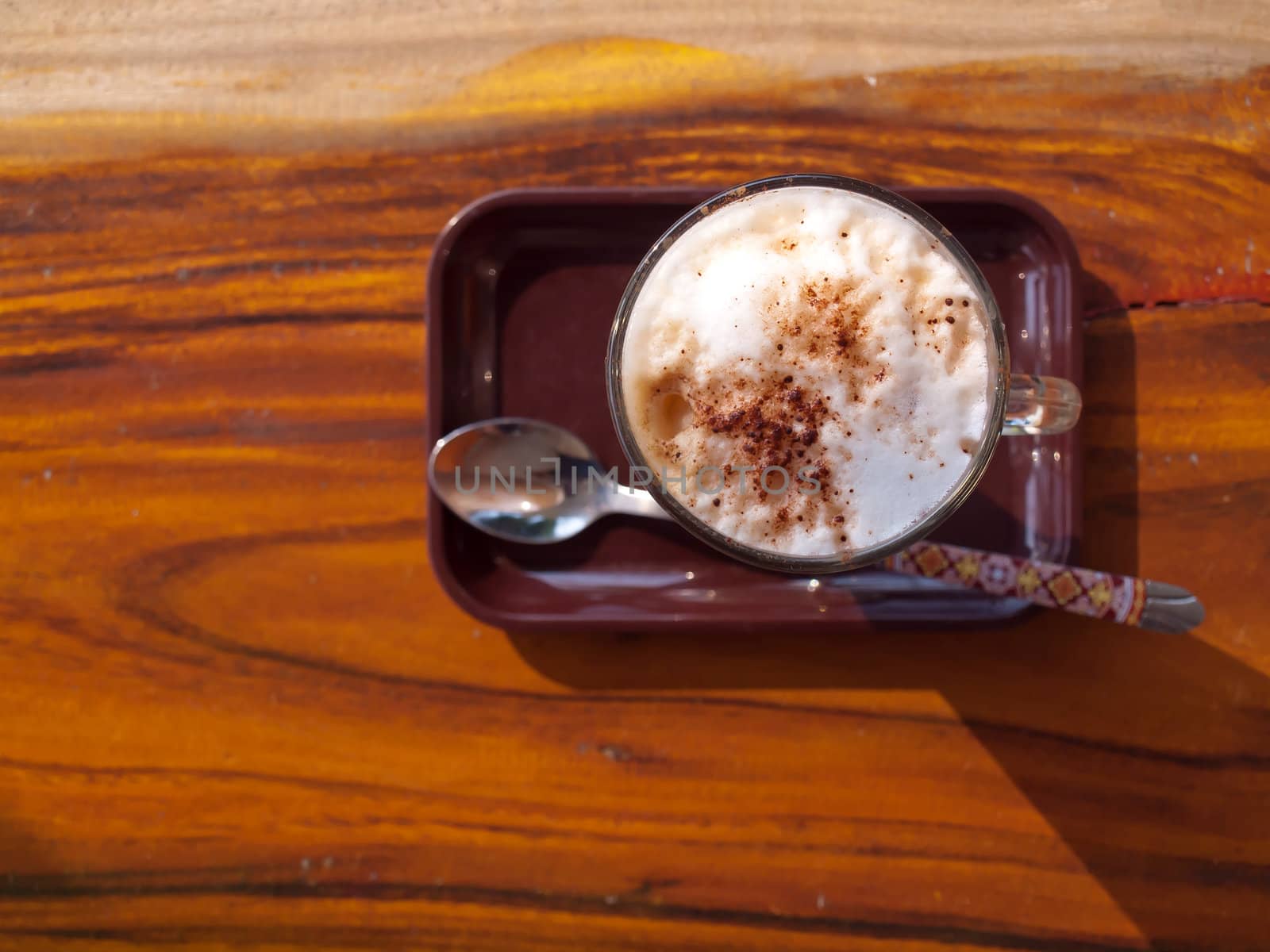 Top view of cup of coffee latte with whipped cream. 