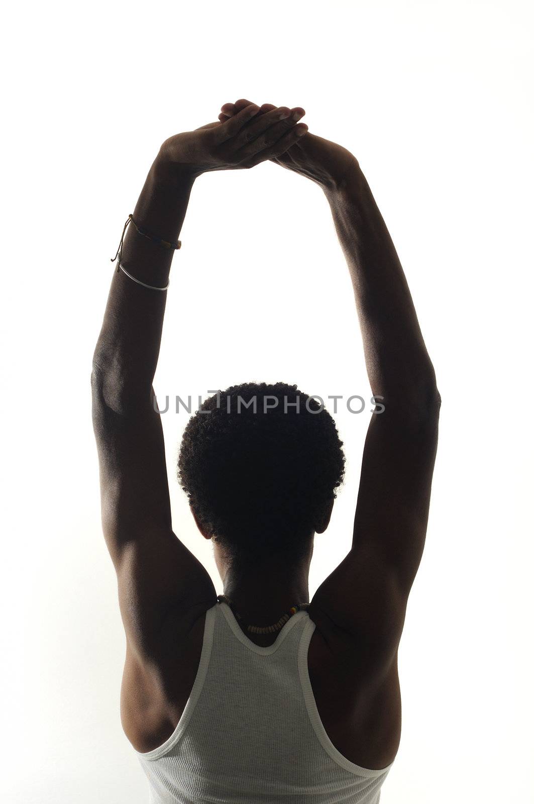 Back portrait of young african american man with raised arms isolated over white background