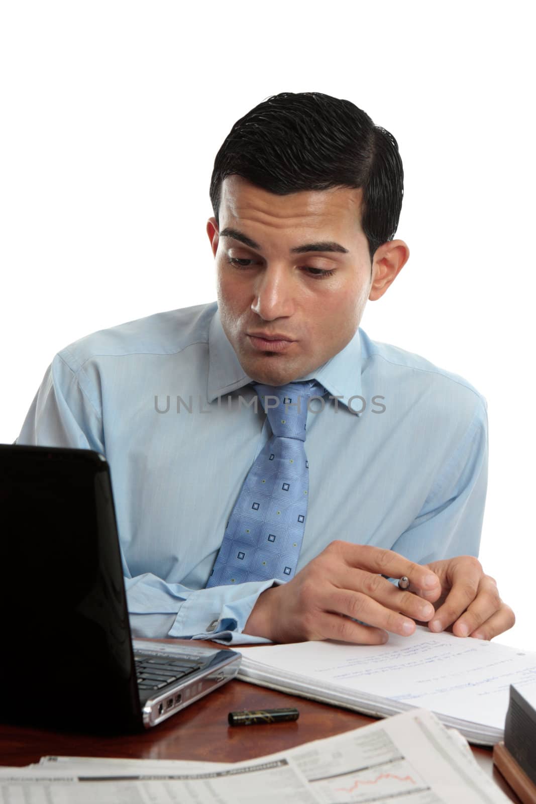 Businessman at desk working by lovleah