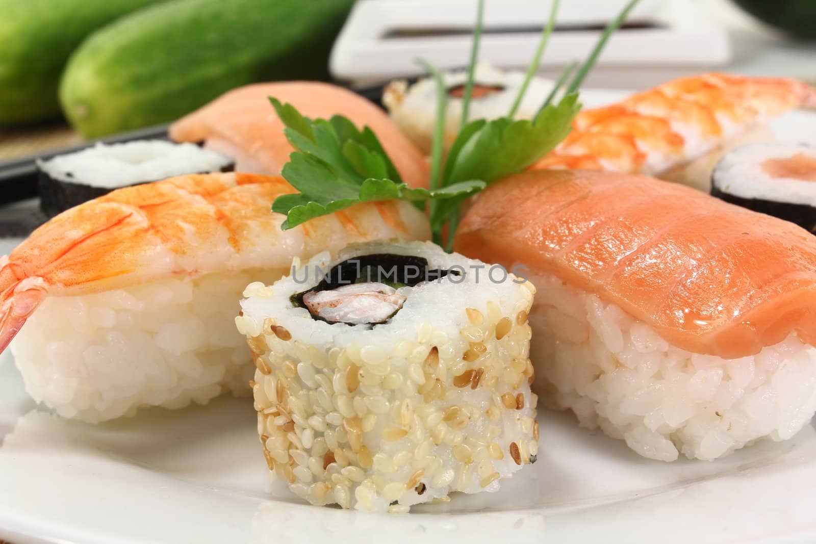 variety of sushi with parsley and chives