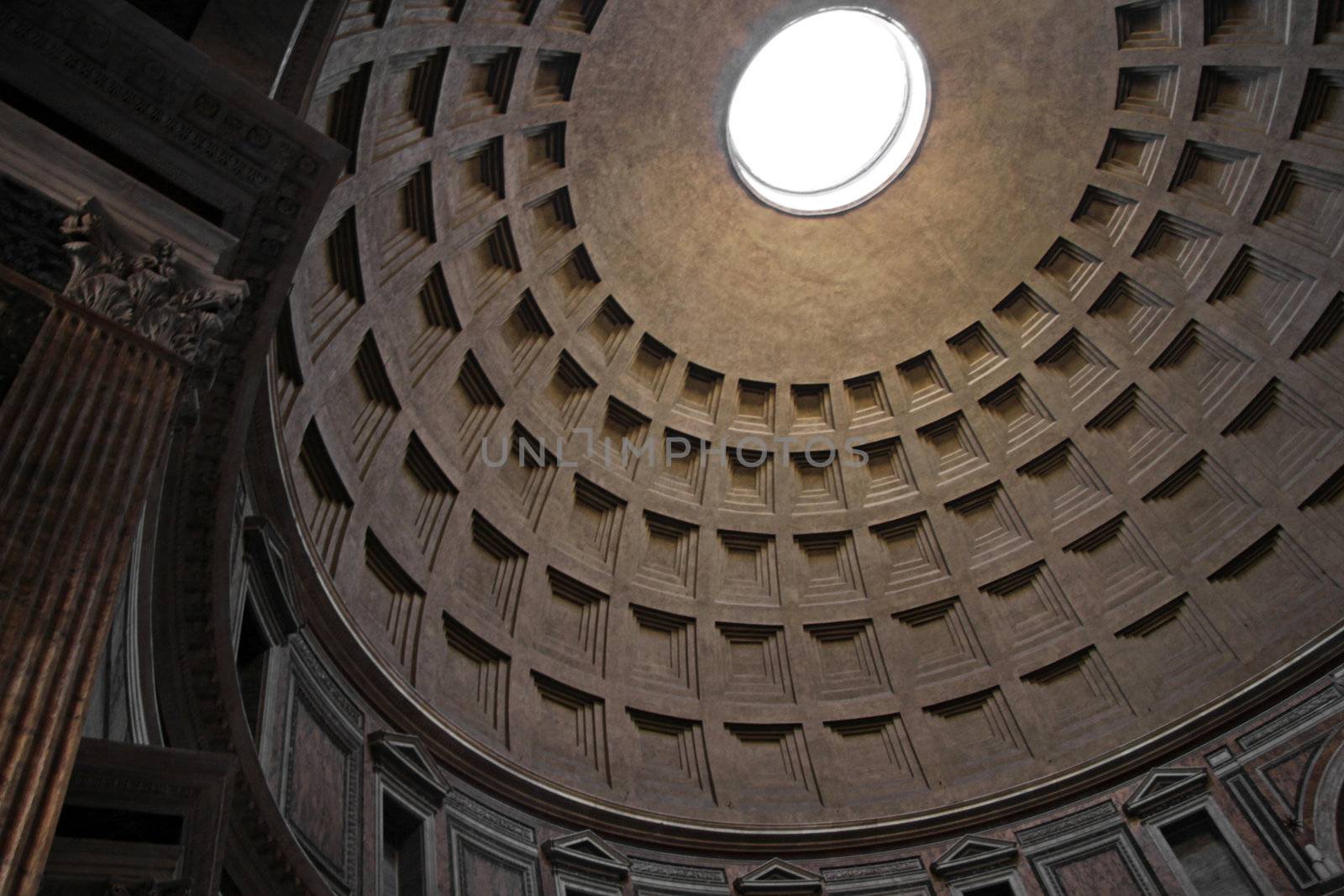 The dome of the Pantheon in Rome, Italy.  The Greek meaning of the word 'Pantheon' is an adjective meaning "to every god".  It was built around 126 AD by emporer Hadrian.
