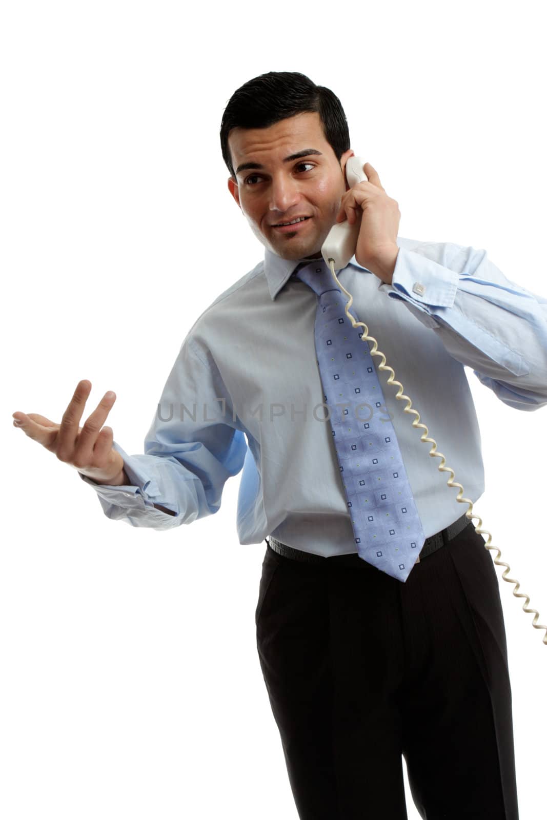 A businessman or salesman speaking effectively on the telephone.  White background.