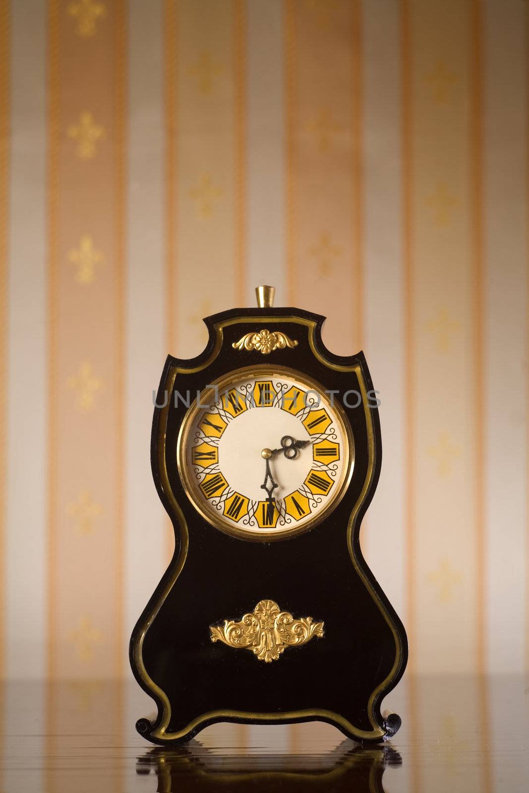 Vintage clocks on wallpaper background by Elisanth