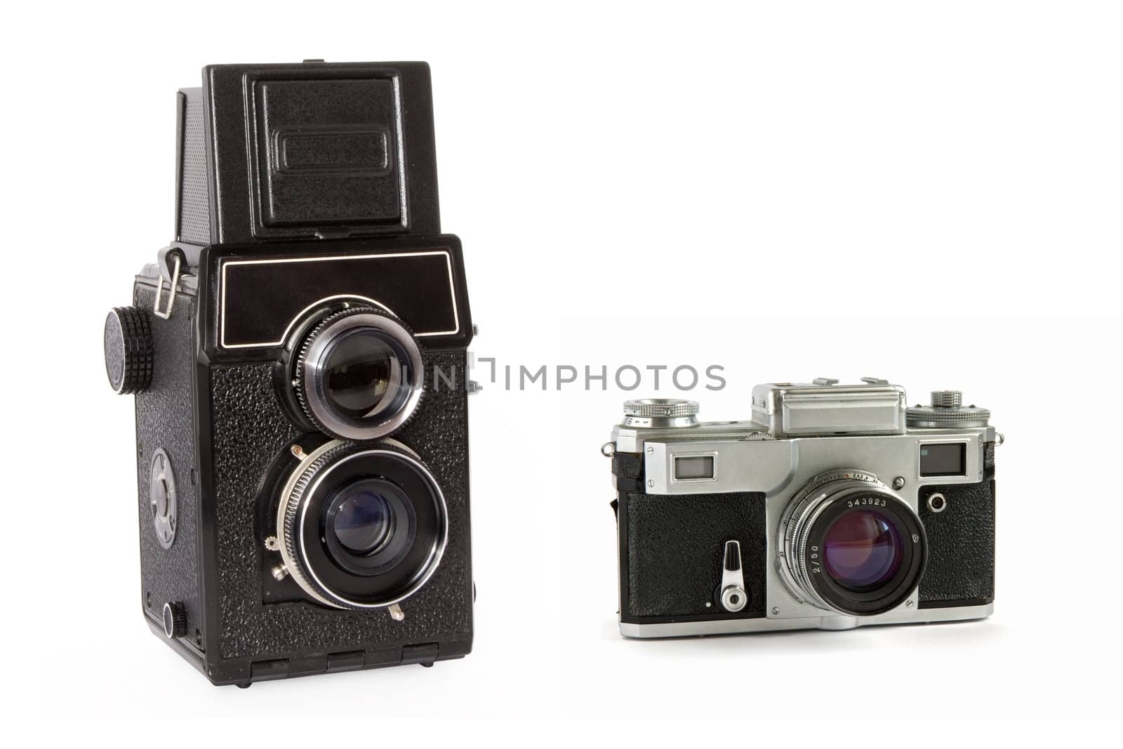 Old rangefinder and  twin-lens reflex large format film cameras isolated on white background