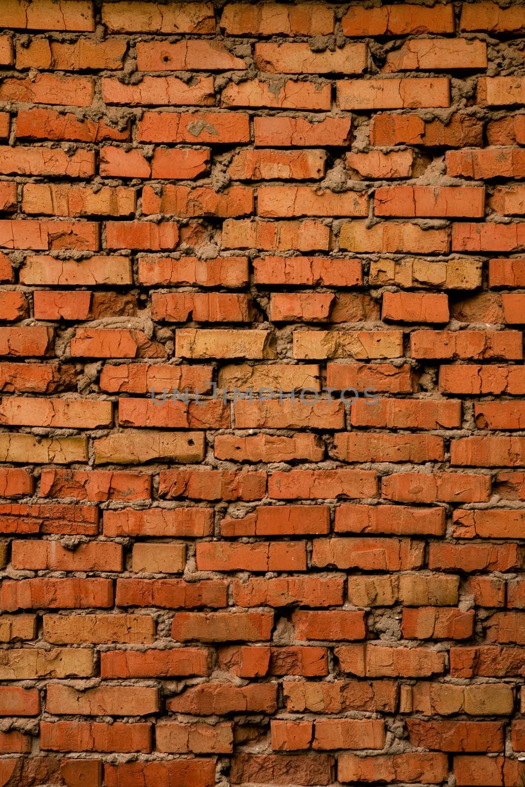 Grungy cracked old brick texture, natural light  