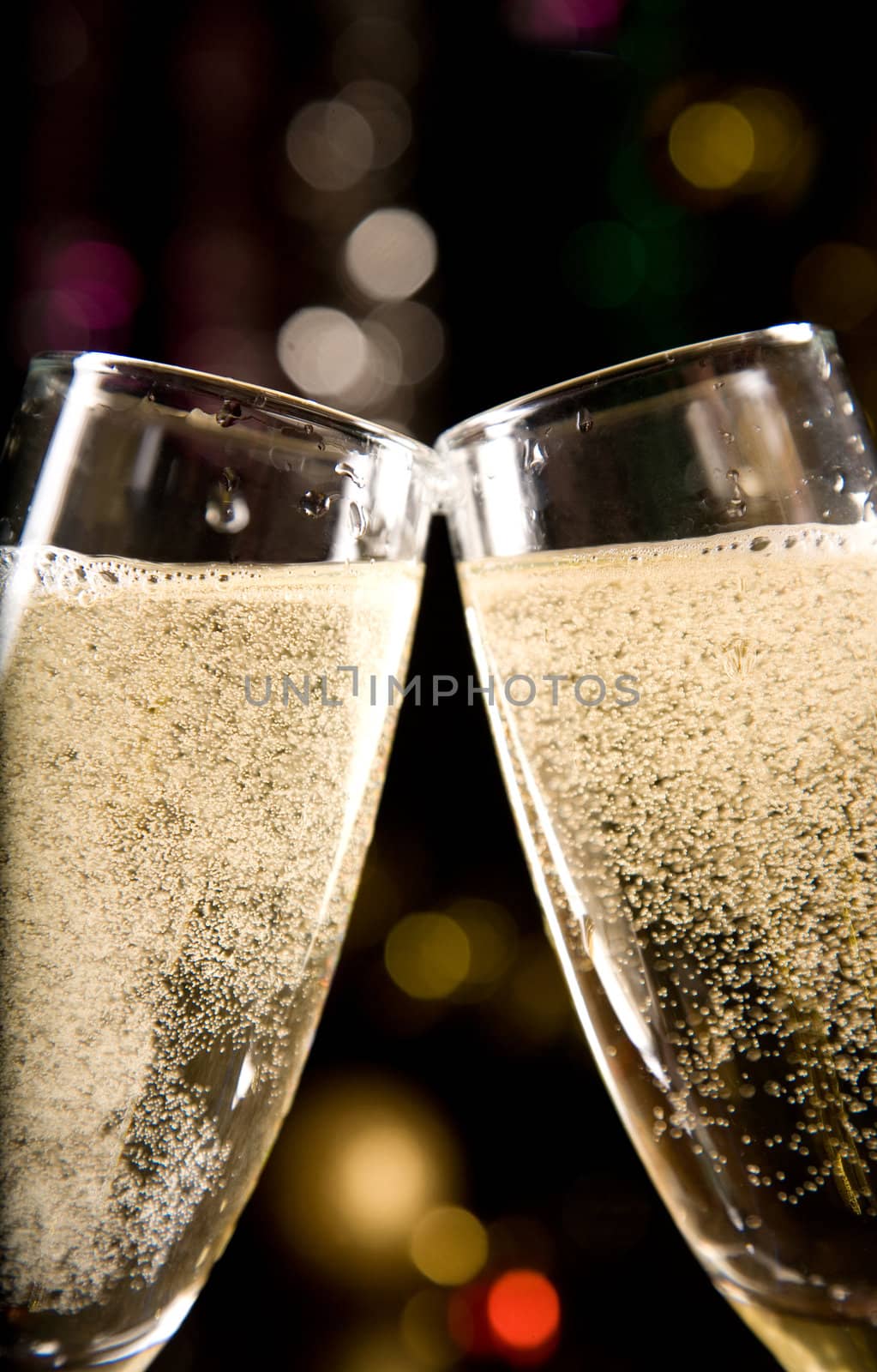 Close-up of two champagne glasses, soft focus