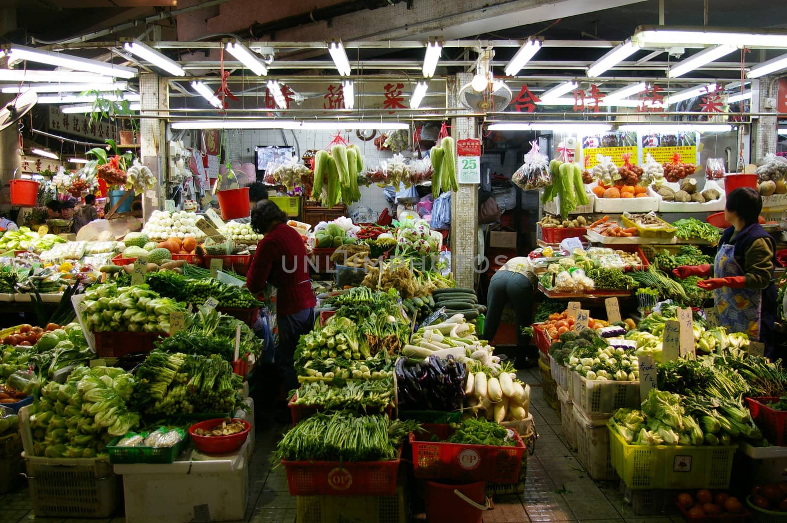 HONG KONG - JAN 24, A wet market selling vegetables in Hong Kong on 24 January, 2010.