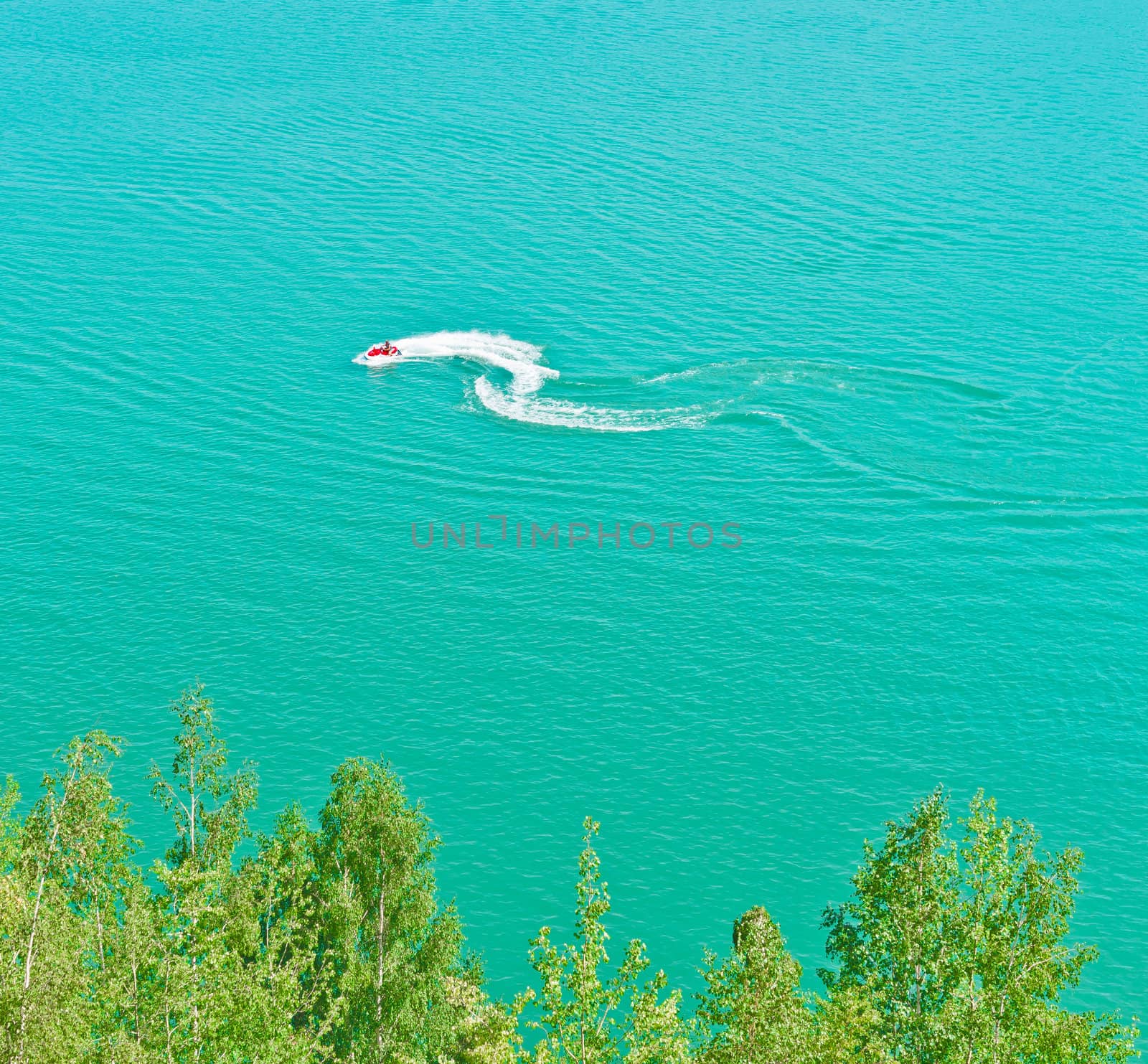 Speedy water scooter on Blue Lake by photoroman