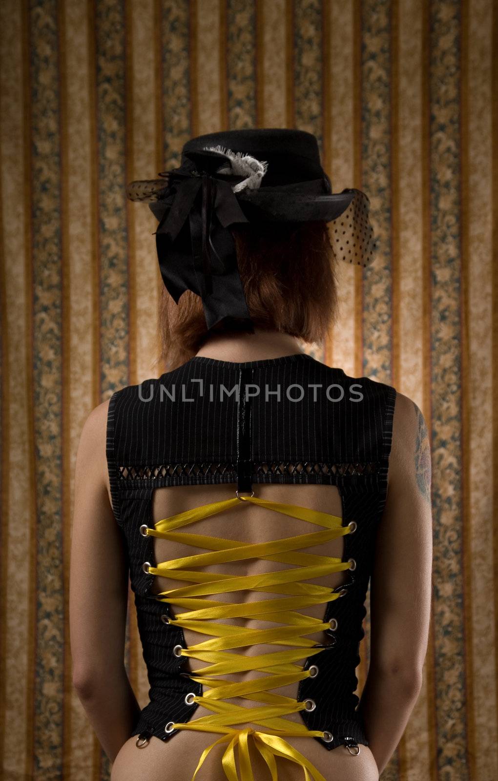 Girl in corset and vintage hat with veil by Elisanth
