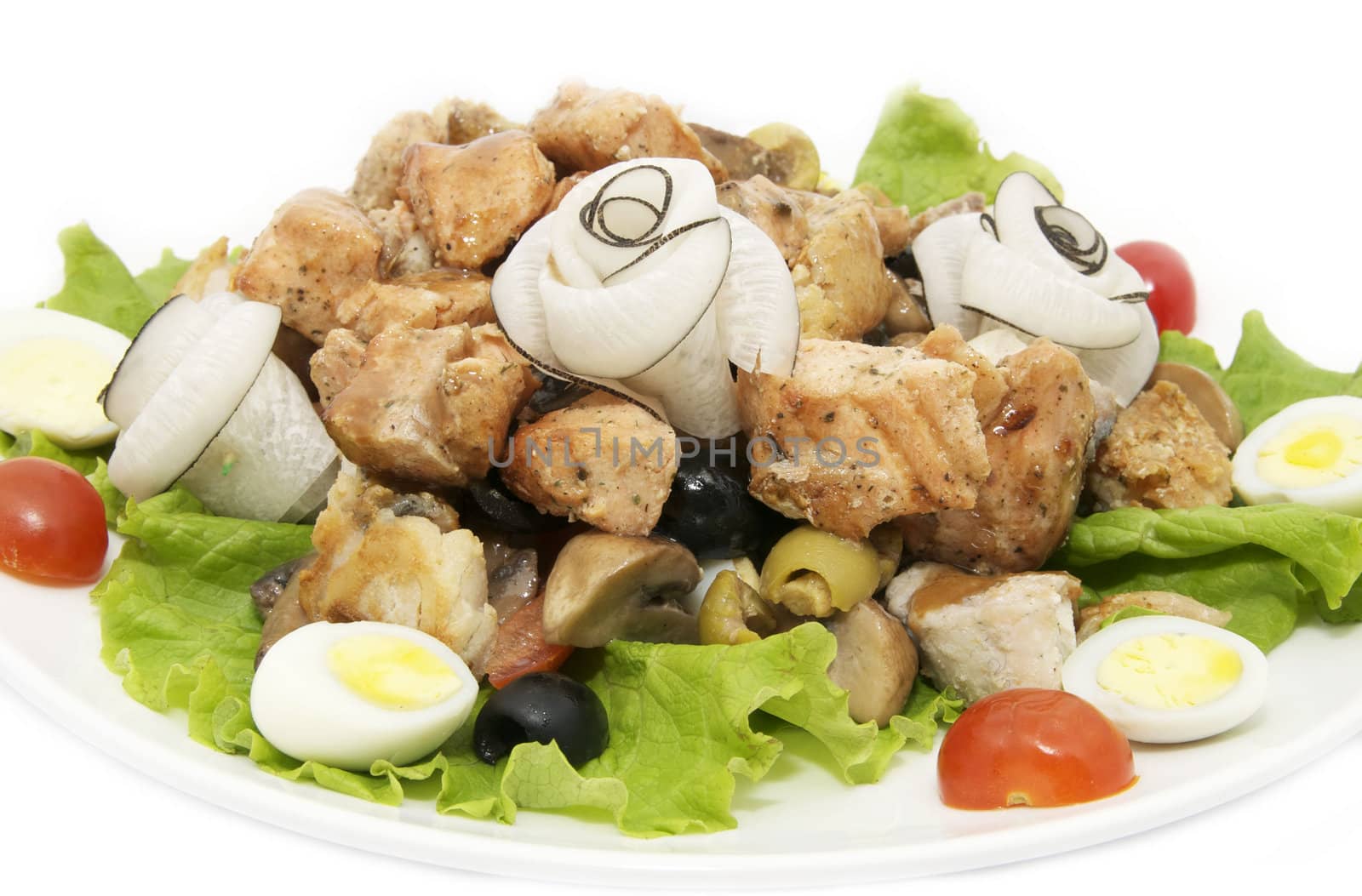 salad of fish and eggs on a white plate in a restaurant