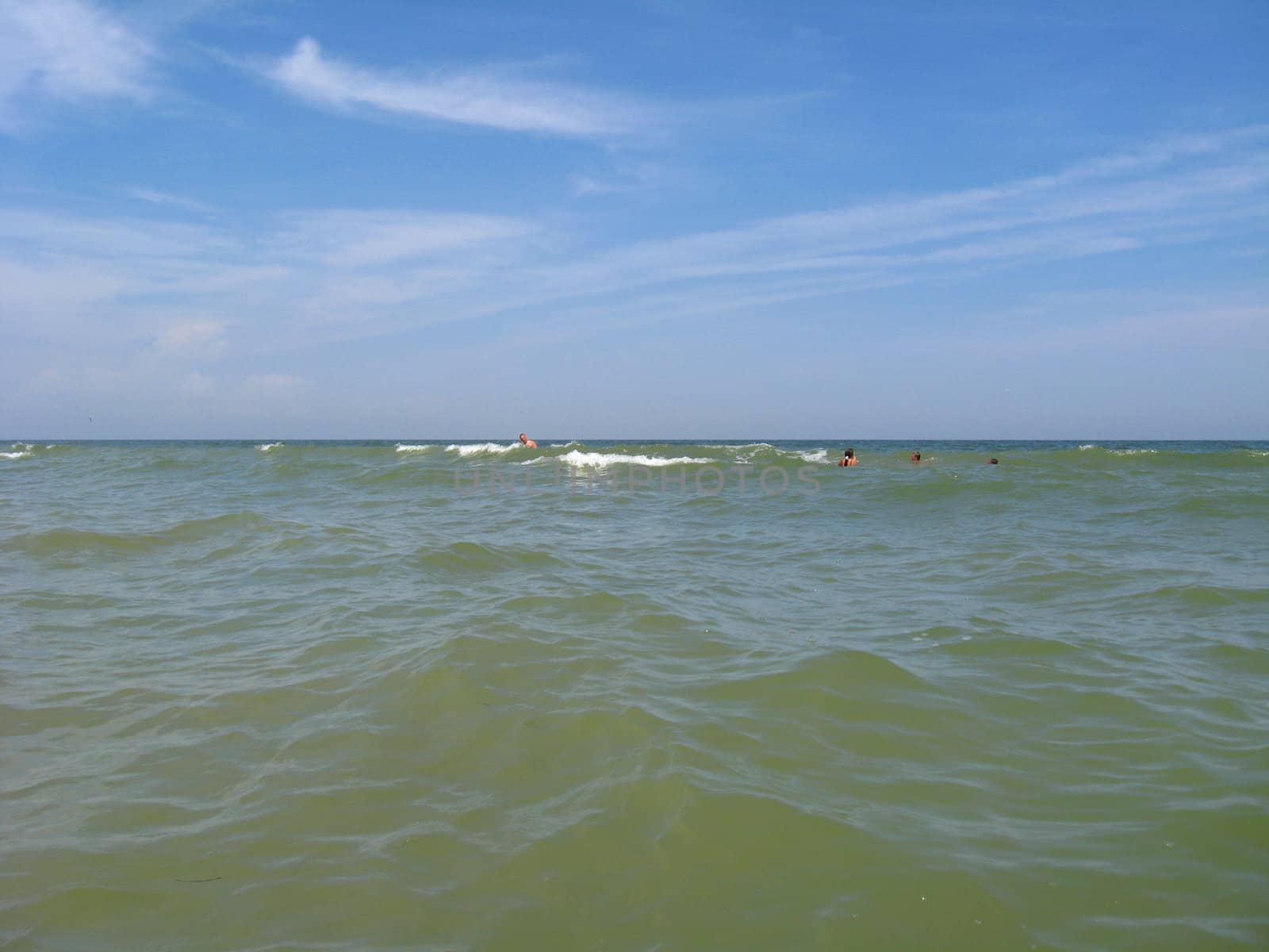 panorama of the sea and people bathing in the sea