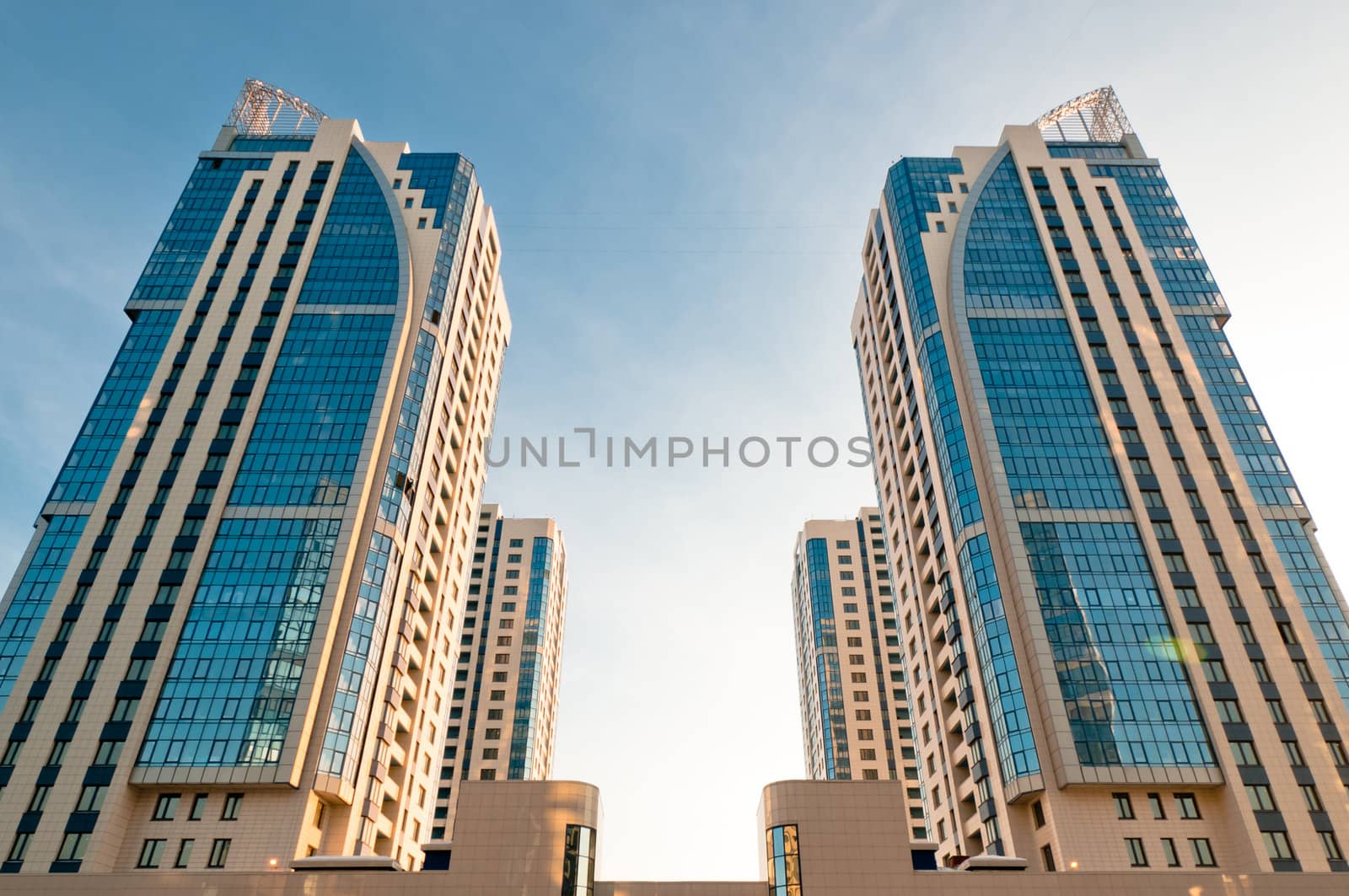 Symmetrical new house and offices towers at sunrise