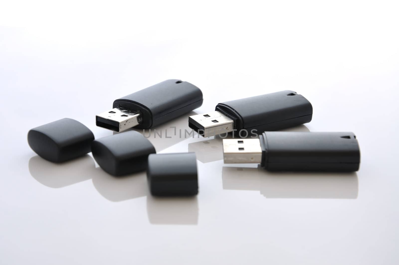 Black usb flash disks, open and ready for use.