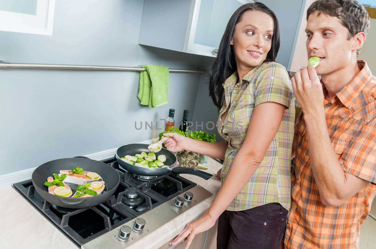 Portrait of a young couple at kitchen
