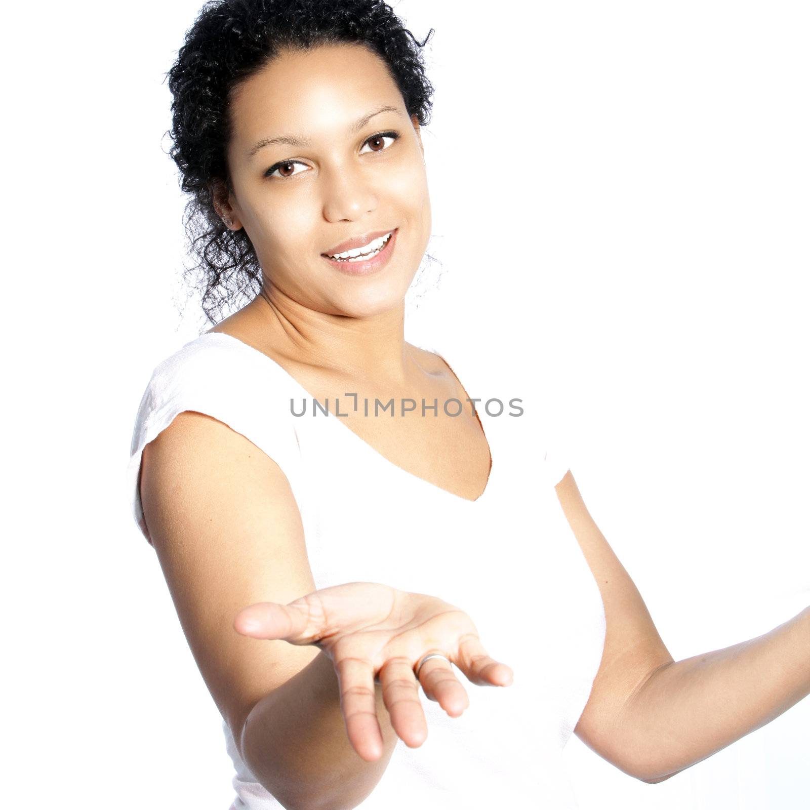 Beautiful young African American woman shrugging her shoulders to indicate that she does not know or that she does not care either way isolated on white