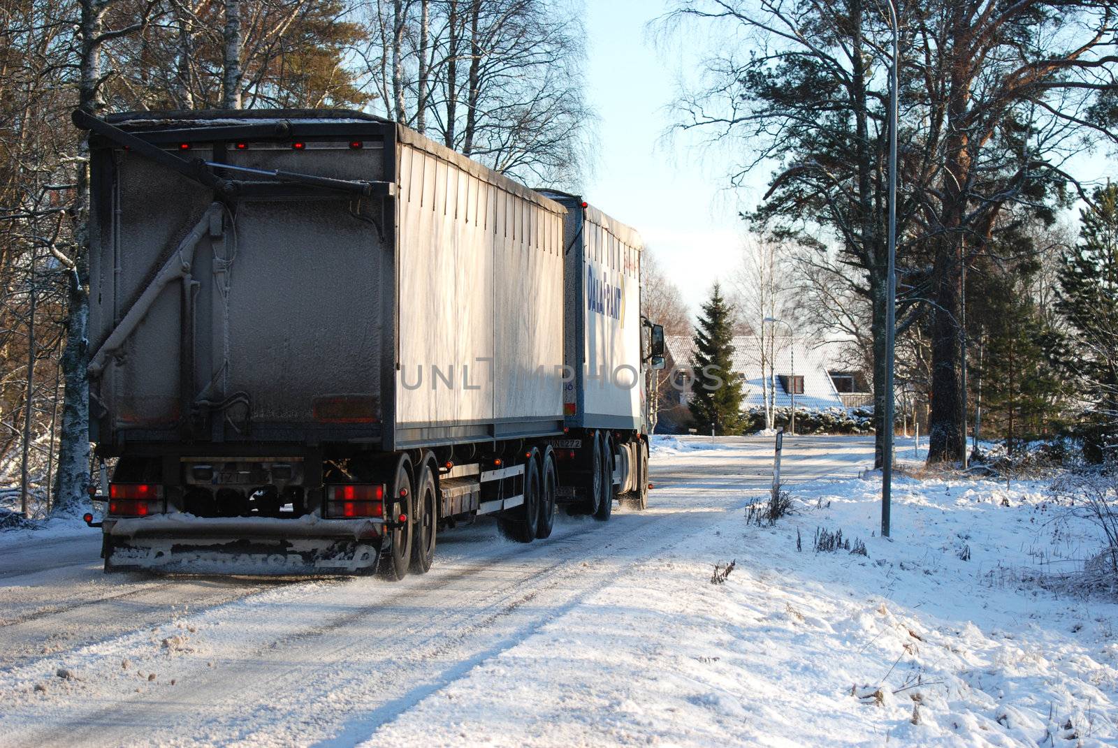 A truck driving on a winter road