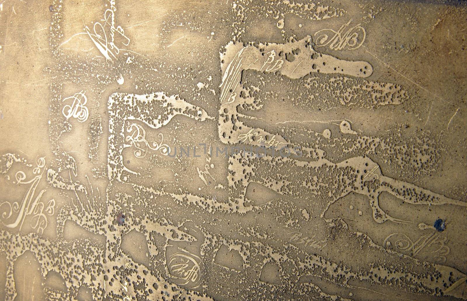 The texture on metal plates. Result of chemical reaction.