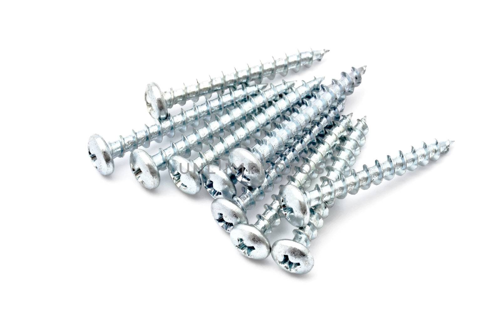 Heap of screws closeup on white background 
