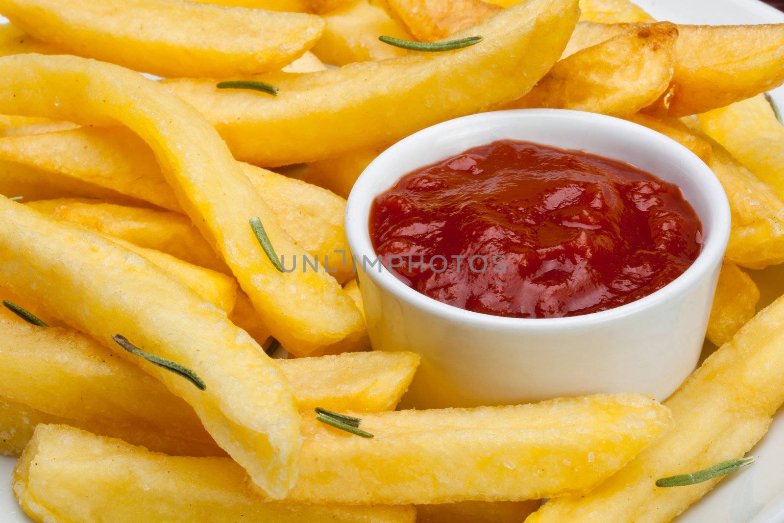 some french fries with ketchup served on a plate