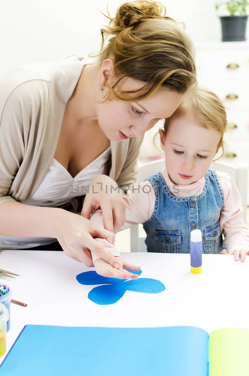 Carving. Mother and daughter doing handicrafts. by dmitrimaruta