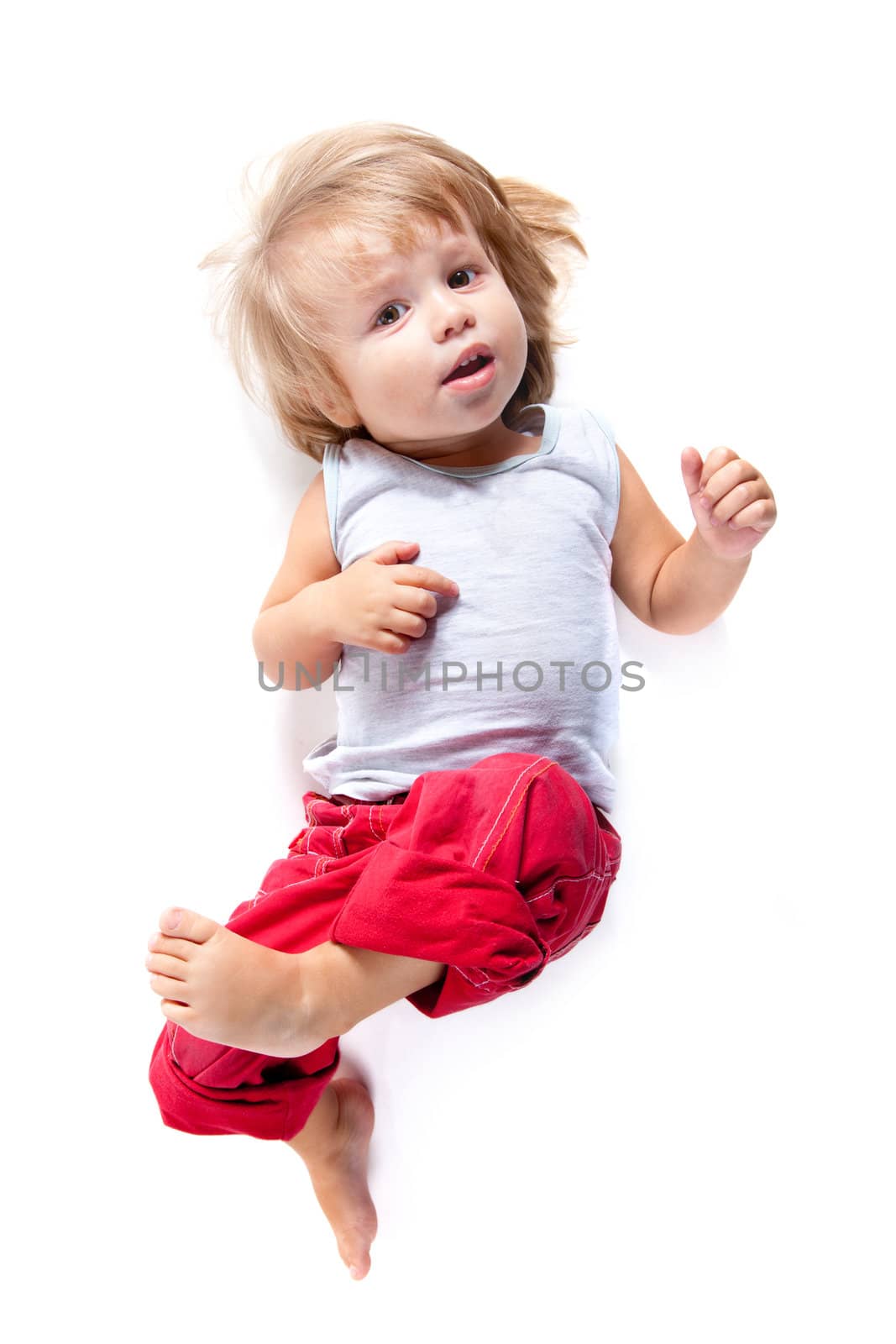Funny boy in red pants, high angle view, isolated on white background 