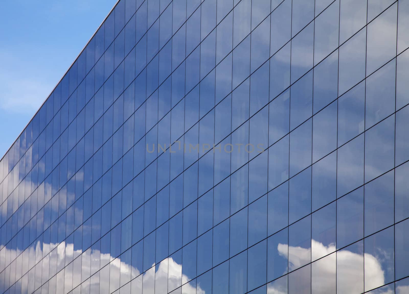 Modern office building and blue sky reflection 