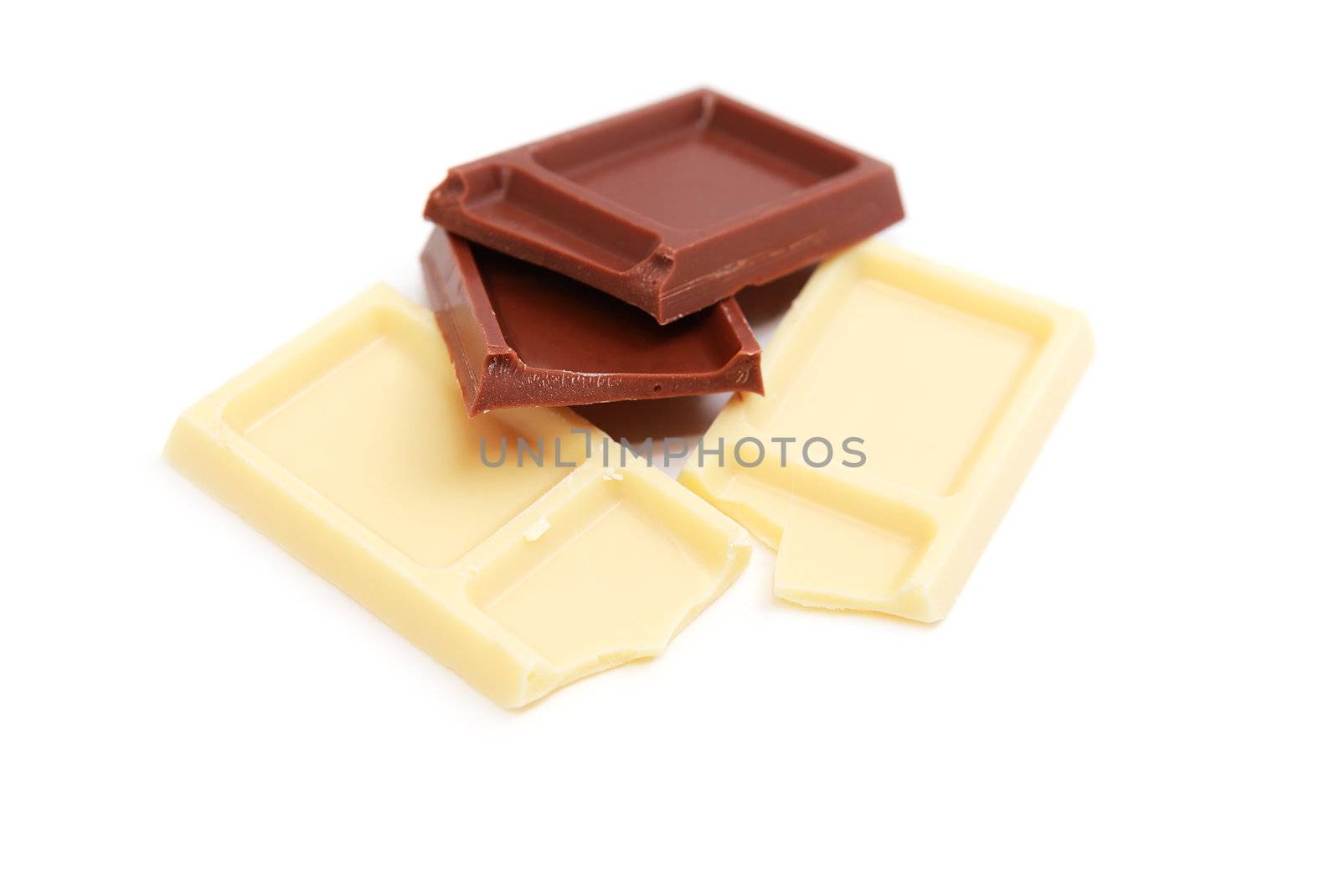 pieces of milk and white chocolate on white background