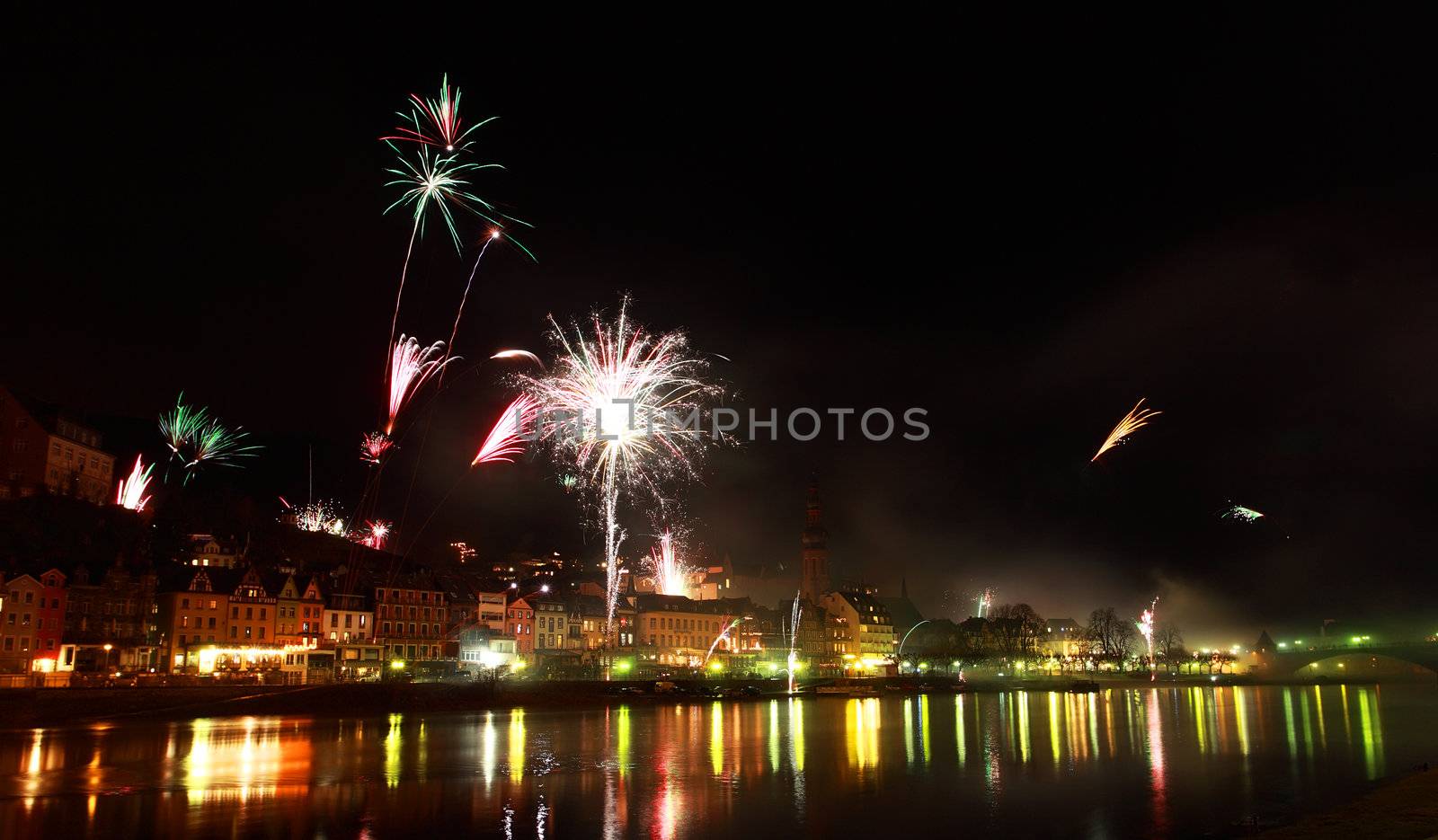 colorful fireworks close to river by catolla