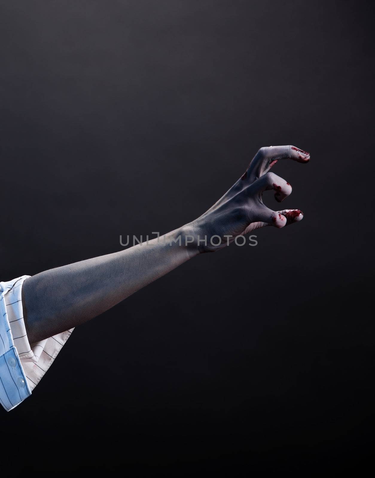 High contrast zombie hand, extreme body-art, studio shot 