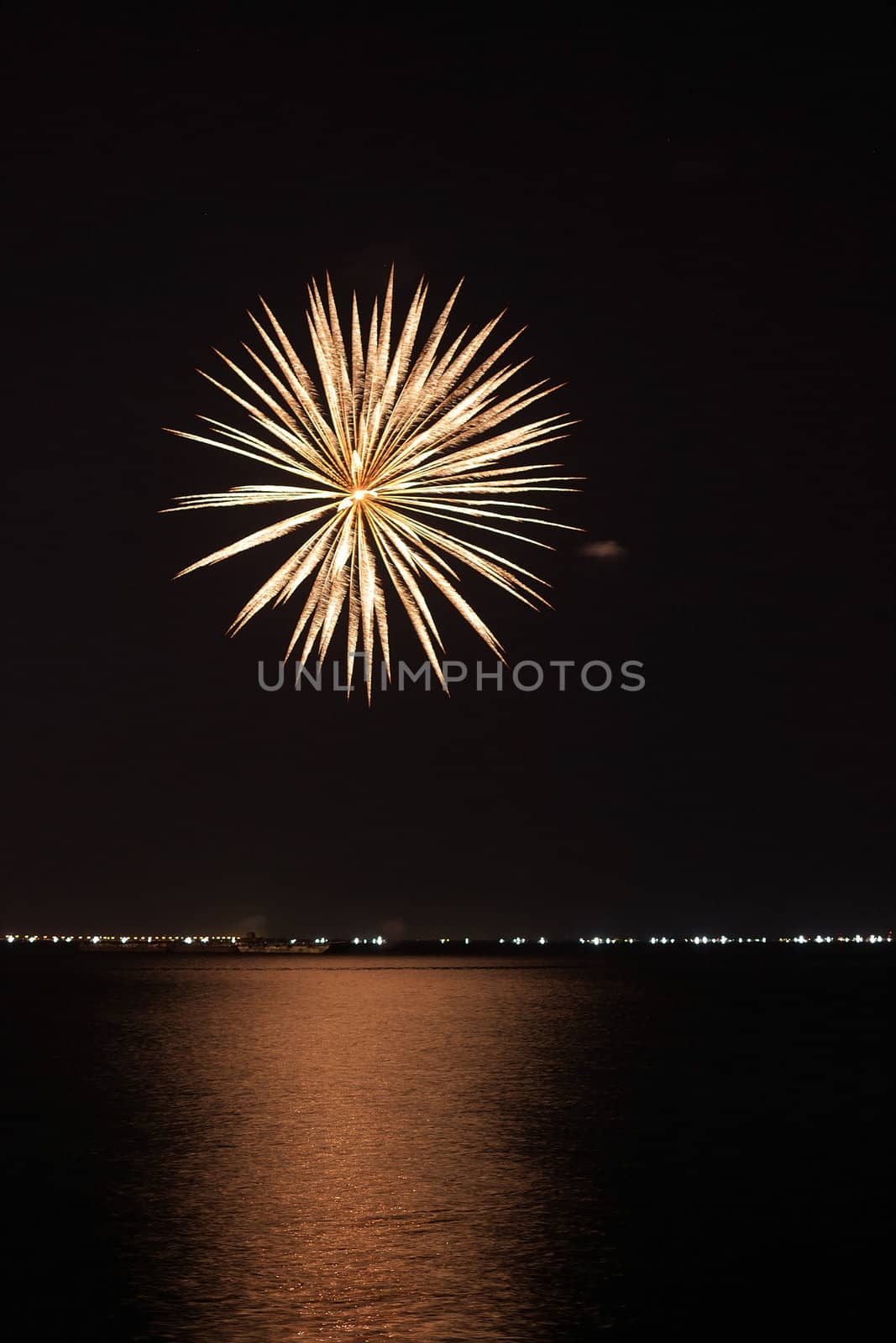 colorful huge fireworks display and reflection.