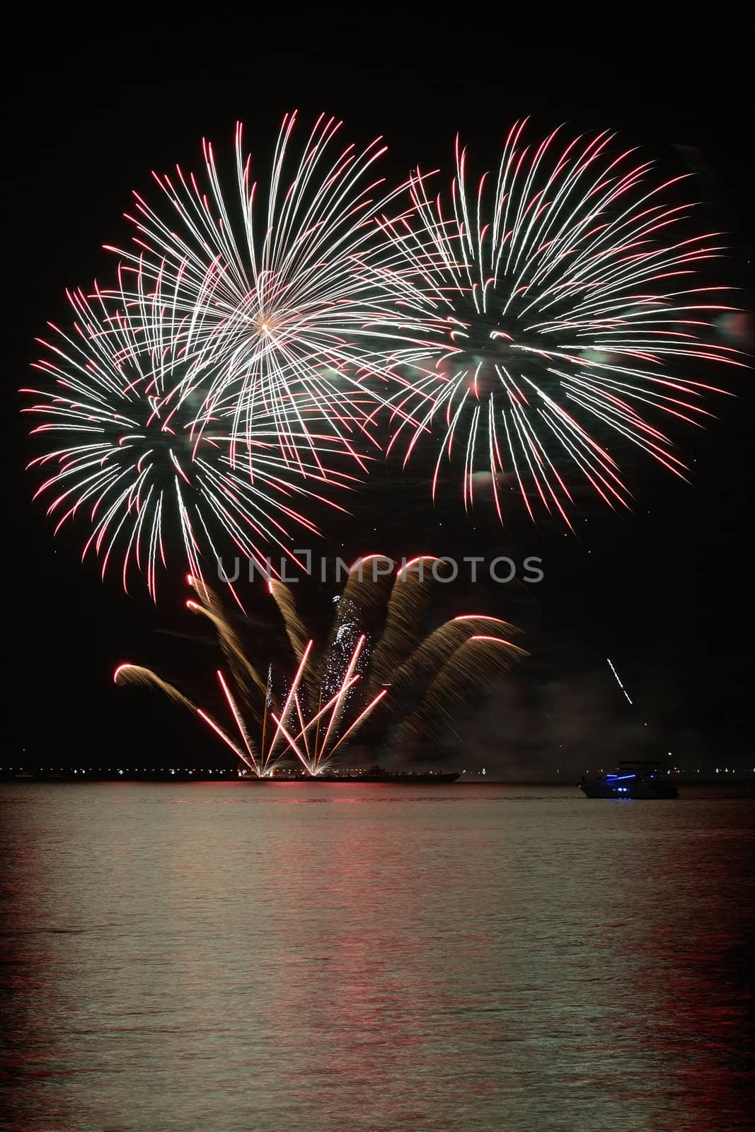 colorful huge fireworks display and reflection.