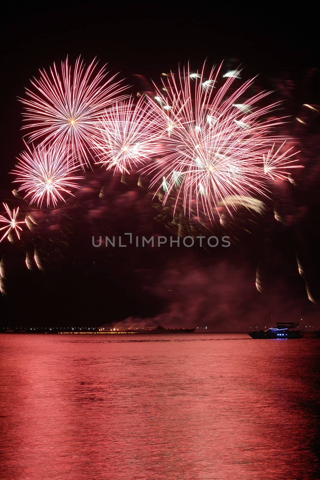 colorful huge fireworks display and reflection.